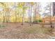 Large backyard with mature trees and wooded area at 2870 Aunt Pitty Pat Ln, Douglasville, GA 30135