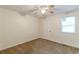 Simple bedroom with carpeted floors and a ceiling fan at 2870 Aunt Pitty Pat Ln, Douglasville, GA 30135