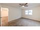 Large bedroom with carpeted floors and access to another bedroom at 2870 Aunt Pitty Pat Ln, Douglasville, GA 30135