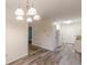 Dining room with chandelier and view into kitchen at 2870 Aunt Pitty Pat Ln, Douglasville, GA 30135