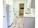 Renovated kitchen with white cabinets and quartz countertops at 2870 Aunt Pitty Pat Ln, Douglasville, GA 30135