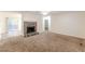 Bright living room with a stone fireplace and access to a deck at 2870 Aunt Pitty Pat Ln, Douglasville, GA 30135