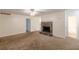 Spacious living room featuring a stone fireplace and carpet flooring at 2870 Aunt Pitty Pat Ln, Douglasville, GA 30135