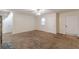 Large living room with neutral carpeting and ceiling fan at 2870 Aunt Pitty Pat Ln, Douglasville, GA 30135