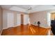 Bright bedroom with hardwood floors, multiple closets, and a ceiling fan at 3609 E Bay St, Duluth, GA 30096