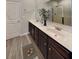 Modern bathroom with double vanity, dark wood cabinets, and a large shower at 2108 Irvin Ct, Kennesaw, GA 30144