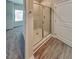 Clean, modern bathroom featuring a glass shower enclosure and wood-style flooring at 2108 Irvin Ct, Kennesaw, GA 30144