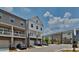 Townhomes with balconies, garages, and a mix of siding colors at 2108 Irvin Ct, Kennesaw, GA 30144