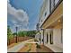 Townhome community with walkway, landscaping, and wooden fence at 2108 Irvin Ct, Kennesaw, GA 30144