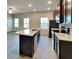 Modern kitchen with dark cabinets, stainless steel appliances, and a large granite-topped island at 2108 Irvin Ct, Kennesaw, GA 30144