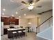 Modern kitchen with dark wood cabinets, stainless steel appliances, and an island with bar seating at 2108 Irvin Ct, Kennesaw, GA 30144