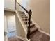Carpeted staircase with dark wood banister and white railings at 2108 Irvin Ct, Kennesaw, GA 30144