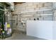 Unfinished basement with laundry hookups and storage at 2950 The Meadows Way, Atlanta, GA 30349