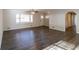 Living room with hardwood floors, wood paneling, and access to other rooms at 2950 The Meadows Way, Atlanta, GA 30349