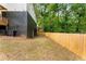 Private backyard with wooden fence and mature trees at 1335 Elizabeth Sw Ave, Atlanta, GA 30310