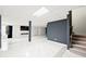 Finished basement with luxury vinyl plank flooring and a modern fireplace at 201 Nina Cir, Locust Grove, GA 30248