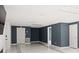 Spacious finished basement with dark walls and marble flooring at 201 Nina Cir, Locust Grove, GA 30248