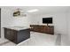 Basement kitchenette with dark cabinetry and marble countertops at 201 Nina Cir, Locust Grove, GA 30248