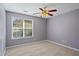 Spacious bedroom with ceiling fan and neutral decor at 201 Nina Cir, Locust Grove, GA 30248