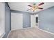 Bright bedroom with ceiling fan and double closets at 201 Nina Cir, Locust Grove, GA 30248