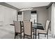 Modern dining room with dark wood table and gray walls at 201 Nina Cir, Locust Grove, GA 30248