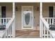 Front door entrance with a white door and decorative glass at 201 Nina Cir, Locust Grove, GA 30248