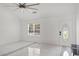 Living room with marble floors, large window, and ceiling fan at 201 Nina Cir, Locust Grove, GA 30248