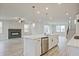 Modern kitchen with a large island, stainless steel appliances, and white cabinetry at 3952 Adler Cir, Buford, GA 30519