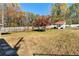 Spacious backyard with a shed and mature trees at 654 Garner Sw Rd, Lilburn, GA 30047