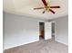 Bright bedroom with ceiling fan and ensuite bathroom access at 19 Bridge Pointe, Douglasville, GA 30134