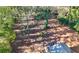 Overview of a lot with mature trees and a small shed at 2905 Waters Sw Rd, Atlanta, GA 30354