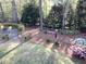 Landscaped backyard with stone patio and arbor at 1713 Wheatstone Dr, Grayson, GA 30017