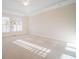 Large bedroom with plush carpeting and abundant natural light at 1713 Wheatstone Dr, Grayson, GA 30017