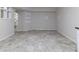 Finished basement with tile flooring and built-in shelving at 4970 Newpark Nw Ln, Acworth, GA 30101