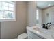 Small bathroom with single vanity, toilet and shower/tub combo at 312 Brook Hollow Ln, Loganville, GA 30052
