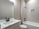 Bathroom with vanity, toilet and shower/tub combo at 312 Brook Hollow Ln, Loganville, GA 30052