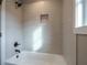 Clean bathroom with a tub and subway tile shower surround at 312 Brook Hollow Ln, Loganville, GA 30052