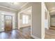 Bright and spacious entryway with hardwood floors and neutral walls at 312 Brook Hollow Ln, Loganville, GA 30052
