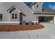 House exterior showcasing gray siding and brick accents at 312 Brook Hollow Ln, Loganville, GA 30052