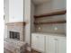 Fireplace with a shiplap wall and wooden mantle at 312 Brook Hollow Ln, Loganville, GA 30052