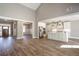 Open concept kitchen with white cabinets and stainless steel appliances at 312 Brook Hollow Ln, Loganville, GA 30052