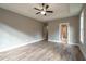 Main bedroom with hardwood floors and a ceiling fan at 312 Brook Hollow Ln, Loganville, GA 30052