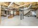 Unfinished basement area with exposed support beams and plumbing at 123 Cherry St, Roswell, GA 30075
