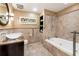 Bathroom with soaking tub, glass enclosed shower, and marble vanity at 123 Cherry St, Roswell, GA 30075