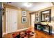 Bright entryway with hardwood floors, decorative rug, and built-in shelving at 123 Cherry St, Roswell, GA 30075