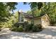 A two-story home with attached two car garage, nestled in a private wooded setting at 123 Cherry St, Roswell, GA 30075