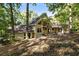 Two-story house exterior with deck and wooded lot at 123 Cherry St, Roswell, GA 30075