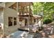 House exterior highlighting a deck, balcony, and surrounding trees at 123 Cherry St, Roswell, GA 30075