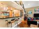 Large kitchen with granite countertops, stainless steel appliances, and hardwood floors at 123 Cherry St, Roswell, GA 30075