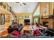 Open living area with hardwood floors, vaulted ceilings, and a cozy stone fireplace at 123 Cherry St, Roswell, GA 30075